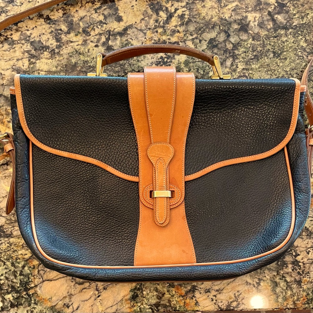 Dooney Bourke Satchel- classic & stylish design for laptops, papers, & briefs.